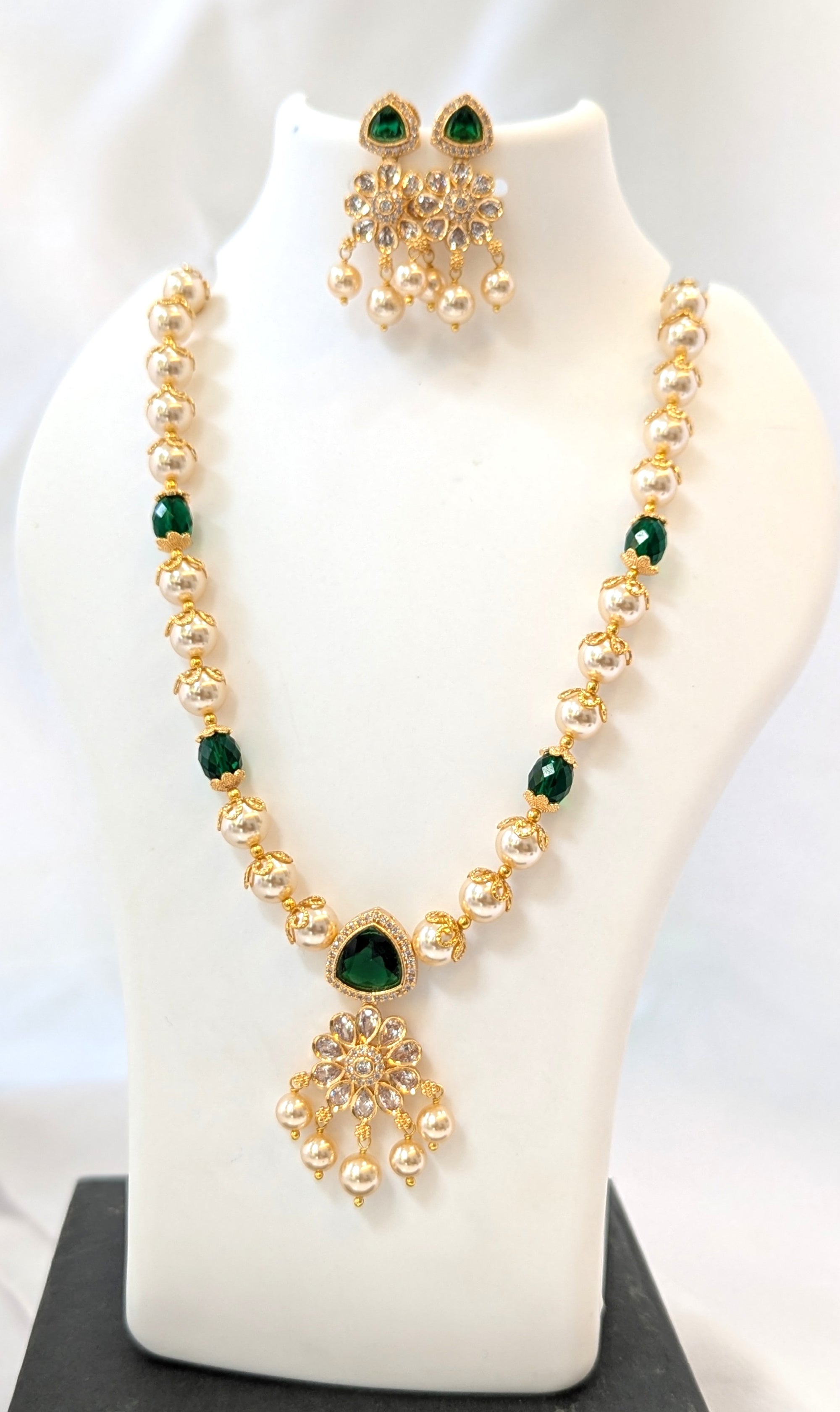 Jewelry set with necklace and earrings on a mannequin bust